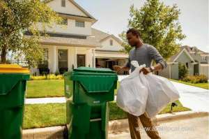 throwing-garbage-bags-into-containers-_bahrain